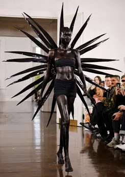 Models present creations during a catwalk show for Fashion East during the Spring/Summer 2022 collection show on the fourth day of London Fashion Week in London on Sept. 20, 2021.