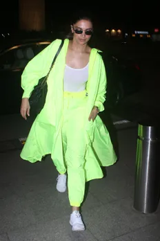 Deepika Padukone wears a bold neon outfit to Mumbai airport | VOGUE India