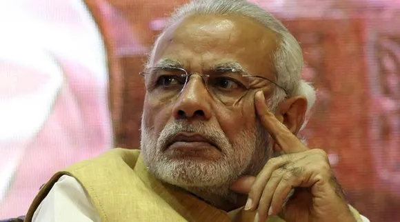 Manmohan schools Modi
