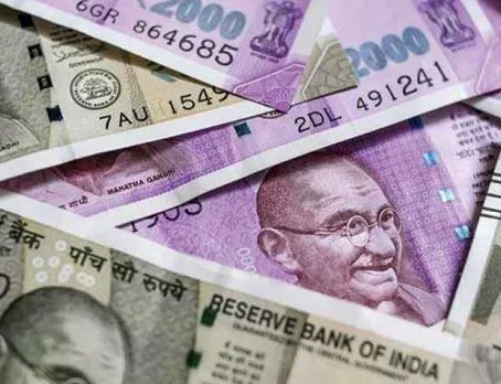 Rupee gains 35 paise to 71.11 against US dollar