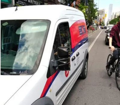 Canada post stops drivers to park in Bike Lanes.