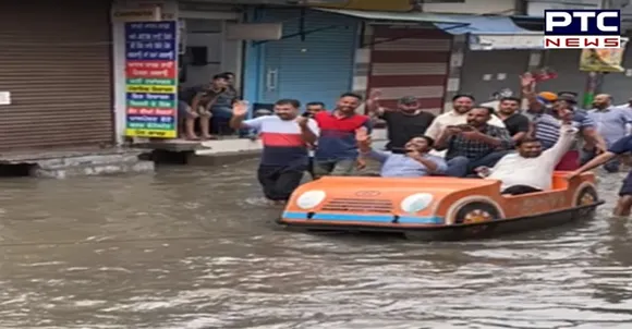 Former Patiala Mayor Kabir Dass takes boat ride on waterlogged streets in Nabha