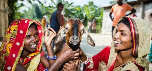 women with goats