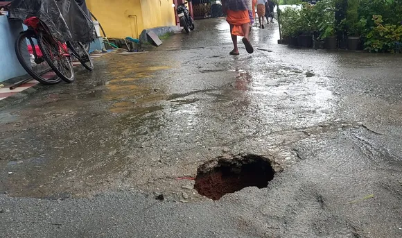 huge pit on road