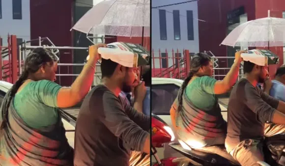 Unconditional Love: Mother Protects Son From Rain, Soaking Herself
