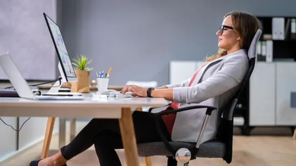 woman sitting bad posture office