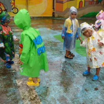 Children enjoying in the rain