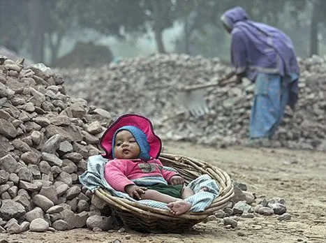 Woman Labourer's child at the construction site