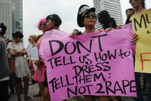 Indonesian men wear miniskirts to end violence against women