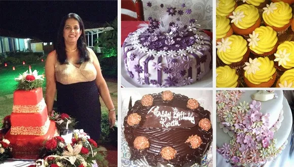 Melissa Martins of Renee's Goodies in Goa stands besides a red and gold decorated wedding cake with flowers along with yellow lemon cupcakes, chocolate ferrero rocher birthday cake, gum paste decor flowers and a purple cake with wands and tulle