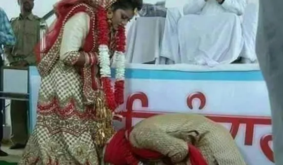 Groom Bends Down To Touch Bride's Feet In Viral Photo, Leaves Social Media Divided