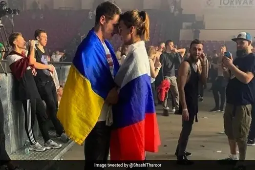 Love Over War: A Russian Flag Hugs A Ukrainian Flag In Viral Photo