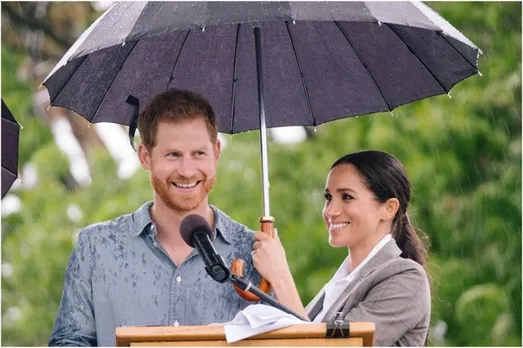 Why Meghan Holding An Umbrella For Her Prince Is Winning Hearts