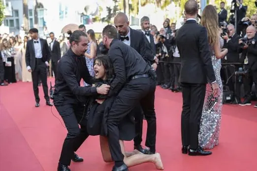 "Stop Raping Us": Topless Woman's Protests Against Ukraine War At Cannes