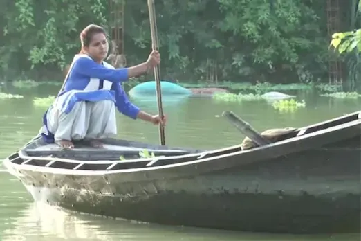 With Parts Of UP Flooded, A Class 11 Girl Rows Boat To School