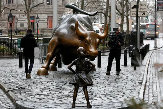 Girl's Statue In Front Of Wall Street's Charging Bull Challenges Gender Imbalance