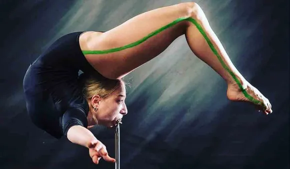 Woman Performs Marinelli Bend Sustain Body Weight By Mouth Grip