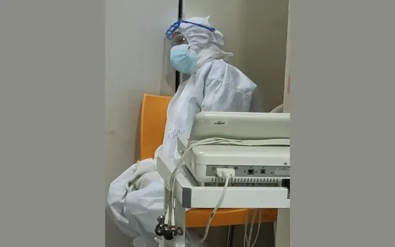 Grim Photo of Exhausted Nurse in PPE Goes Viral as COVID-19 Cases Spike