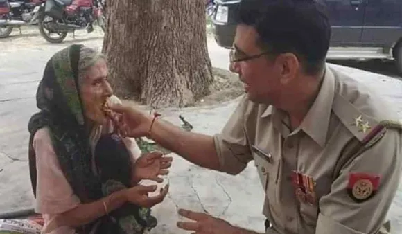Viral Picture: Cop Praised On Social Media For Feeding Elderly Woman