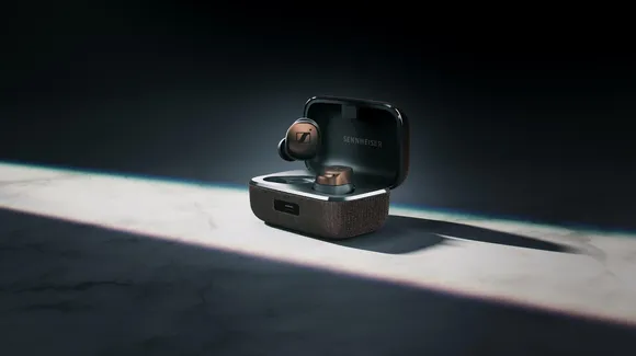 A black and brown earphones in a case

Description automatically generated