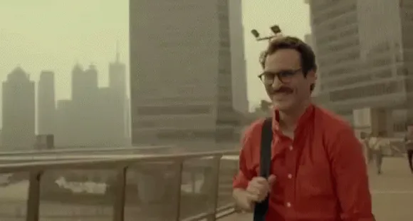 Her GIF - Joaquin Phoenix Happy Walking - Discover & Share GIFs