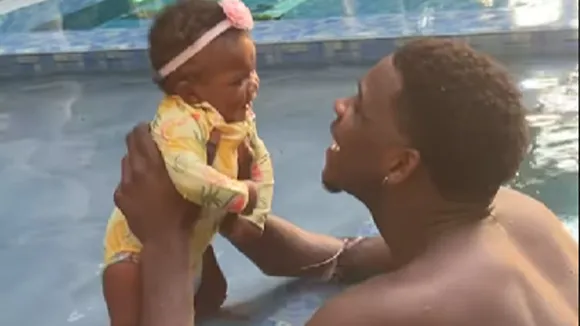 WATCH: Minnesota star Anthony Edwards takes a 'fatherly' dip in swimming pool with his daughter