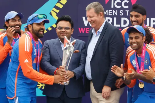 Rohit Sharma collects the trophy from Jay Shah 