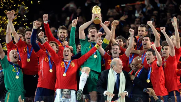 Spain players celebrate lifting the 2010 World Cup trophy