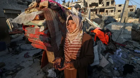 Palestinian Woman Cleans Home Damaged by Israeli Airstrikes, Prepares to Rebuild Life
