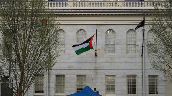 Harvard University Students Raise Palestinian Flag Over Harvard Statue , Spot Typically Reserved for American Flag