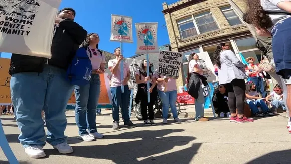 Hundreds March in Milwaukee May Day Rally, Denouncing Trump's Policies as He Campaigns Nearby