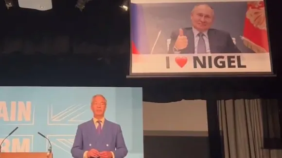 Activist Stunt Disrupts Nigel Farage's Speech with Banner of Putin