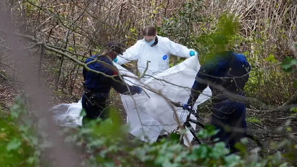 Two Men Charged with Murder After Human Remains Found in Salford Wetlands