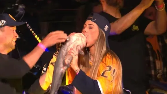 Canadian Singer Alli Walker Goes Viral for Drinking Beer from Dead Catfish at NHL Game