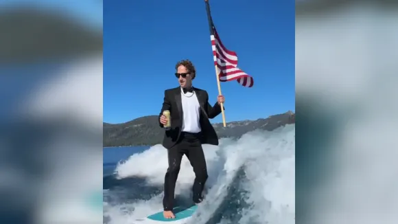 Mark Zuckerberg Makes Waves Surfing in a Tuxedo with Beer and US Flag on Fourth of July