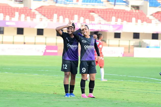 Lynda Kom and Indumathi celebrating a goal against Kickstart FC