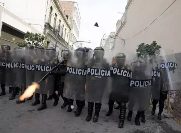 Peru police use tear gas to block protesters from marching