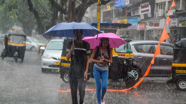 Commuters amid rains, in Navi Mumbai, Monday, May 13, 2024