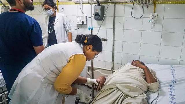 A patient admitted with suspected heat stroke and exhaustion undergoes treatment at LNJP hospital, New Delhi, on Wednesday