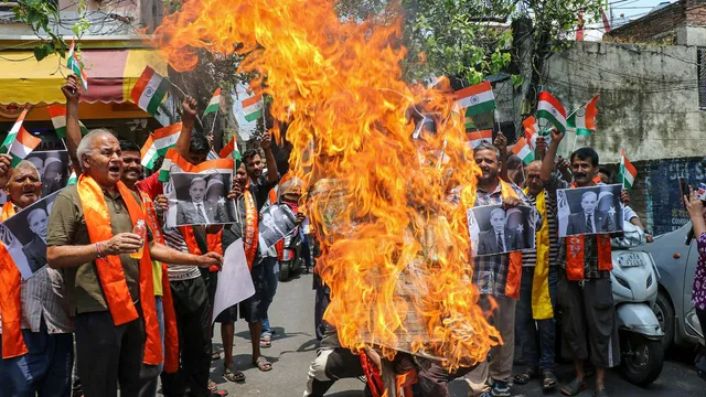 People stage a protest following a terrorist attack on an Army convoy in J&K's Kathua, in Jammu, Tuesday, July 9, 2024.