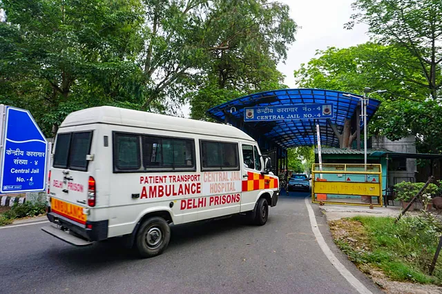 An ambulance arrives at Tihar Jail, in New Delhi