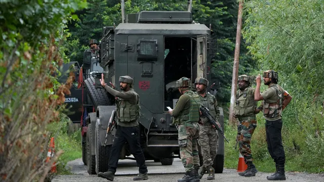 Security personnel during an encounter with terrorists at Ahlan Gagarmandu forest area, in Anantnag district of South Kashmir, Sunday, Aug. 11, 2024.