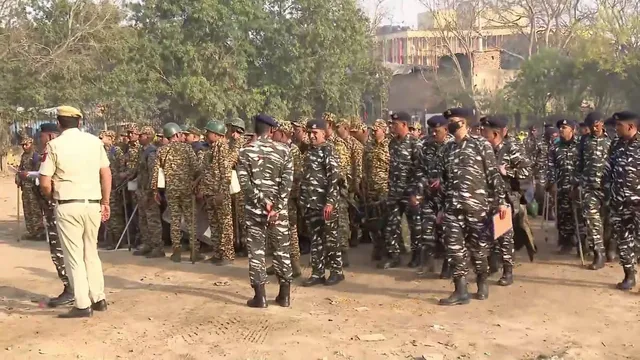 Security personnel stand guard in view of the Kisan Mahapanchayat at Ramlila Maidan, in New Delhi