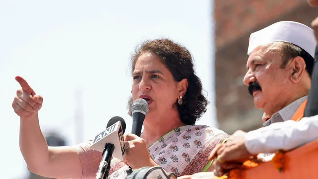 Congress leader Priyanka Gandhi Vadra with the party candidate from Amethi Kishori Lal Sharma during a roadshow before filing his nomination for the Lok Sabha elections, in Amethi district