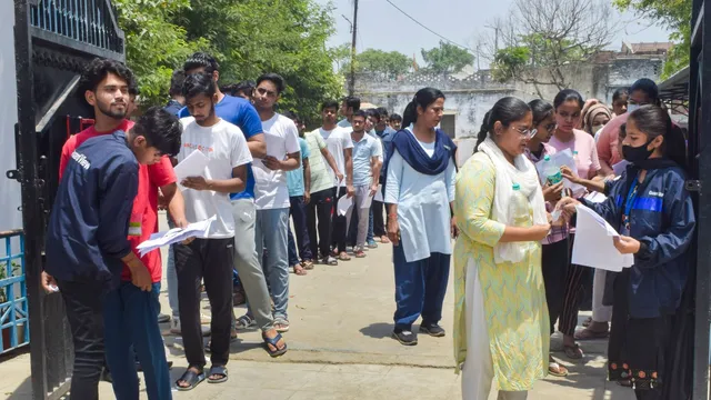 Candidates undergo security check as they arrive to appear for the NEET (UG) 2024 exam at an examination centre