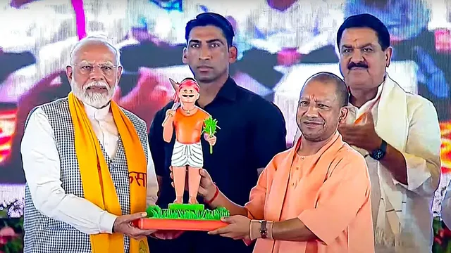 Prime Minister Narendra Modi being welcomed by UP Chief Minister Yogi Adityanath as he attends the Kisan Samman Sammelan, in Varanasi, Tuesday, June 18, 2024.