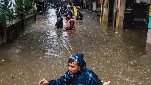 Locals being evacuated due to heavy waterlogging following incessant rains, in Pune district, Thursday, July 25, 2024