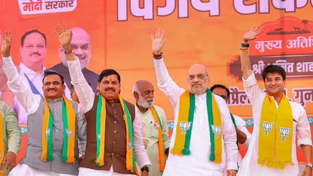 Union Home Minister and BJP leader Amit Shah with Union Minister Jyotiraditya Scindia and Madhya Pradesh Chief Minister Dr Mohan Yadav during a public meeting for Lok Sabha elections, in Ashoknagar district, Madhya Pradesh, Friday, April 26, 2024