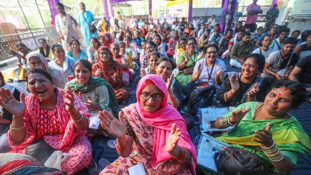 Pilgrims wait to get themselves registered for the Amarnath Yatra 2024, in Jammu, Sunday, June 30, 2024.