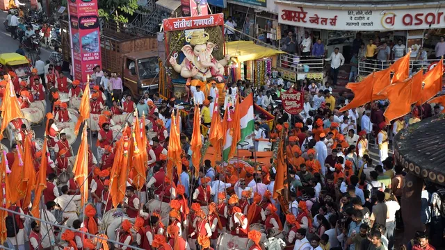 Devotees carry an idol of Ganesha to a pandal for the Ganesh Chaturthi celebration, in Nagpur, Monday, Sept. 18, 2023